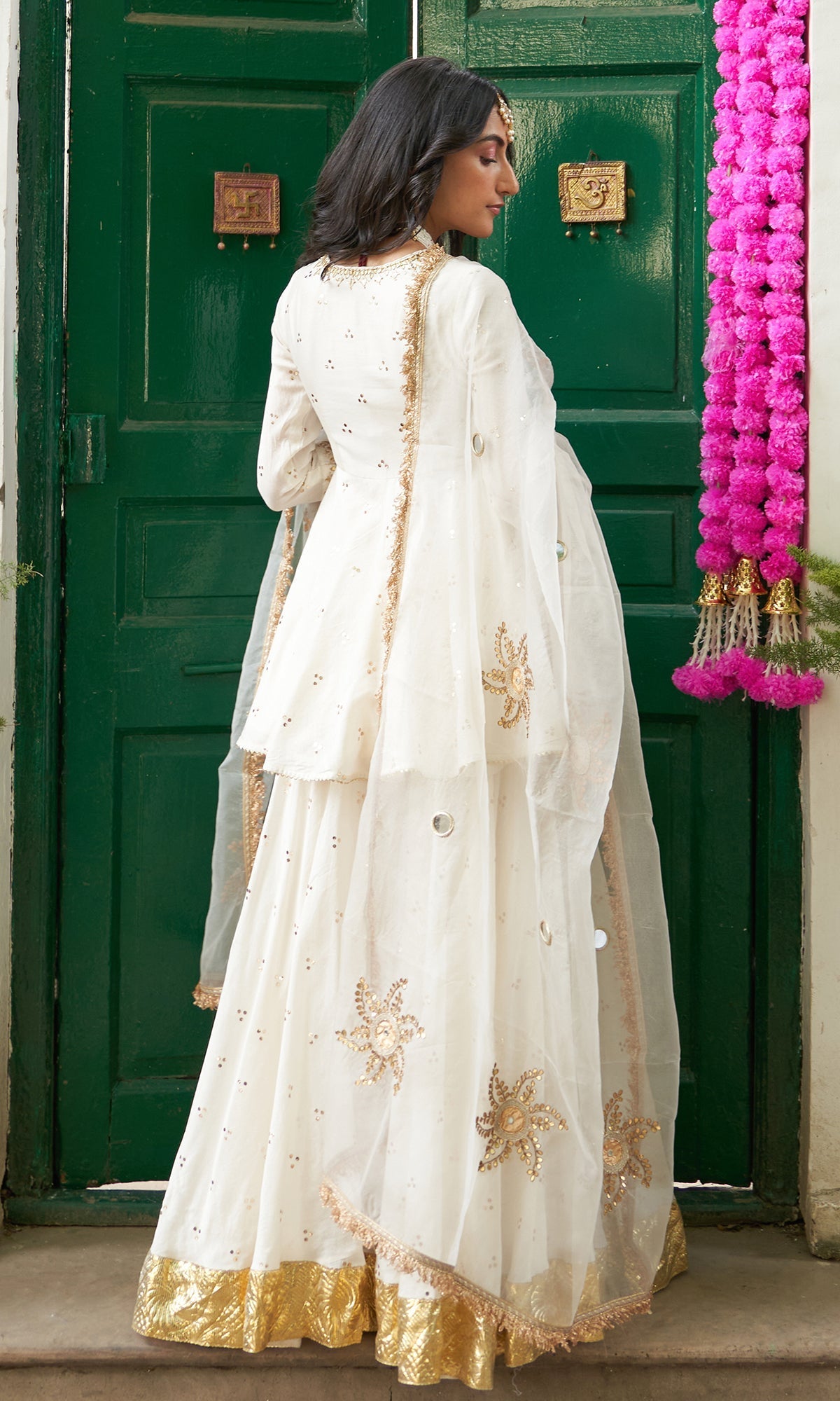 Divya Khosla Kumar in Jhilmil White Lehenga With Kurta And Dupatta Set Of 3