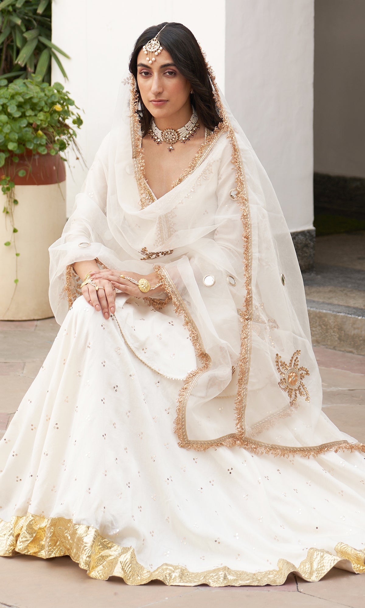 Divya Khosla Kumar in Jhilmil White Lehenga With Kurta And Dupatta Set Of 3