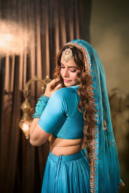 Amna Sharif in Solid Turquoise Lehenga with Blouse and Embroidered Dupatta (set of 3)