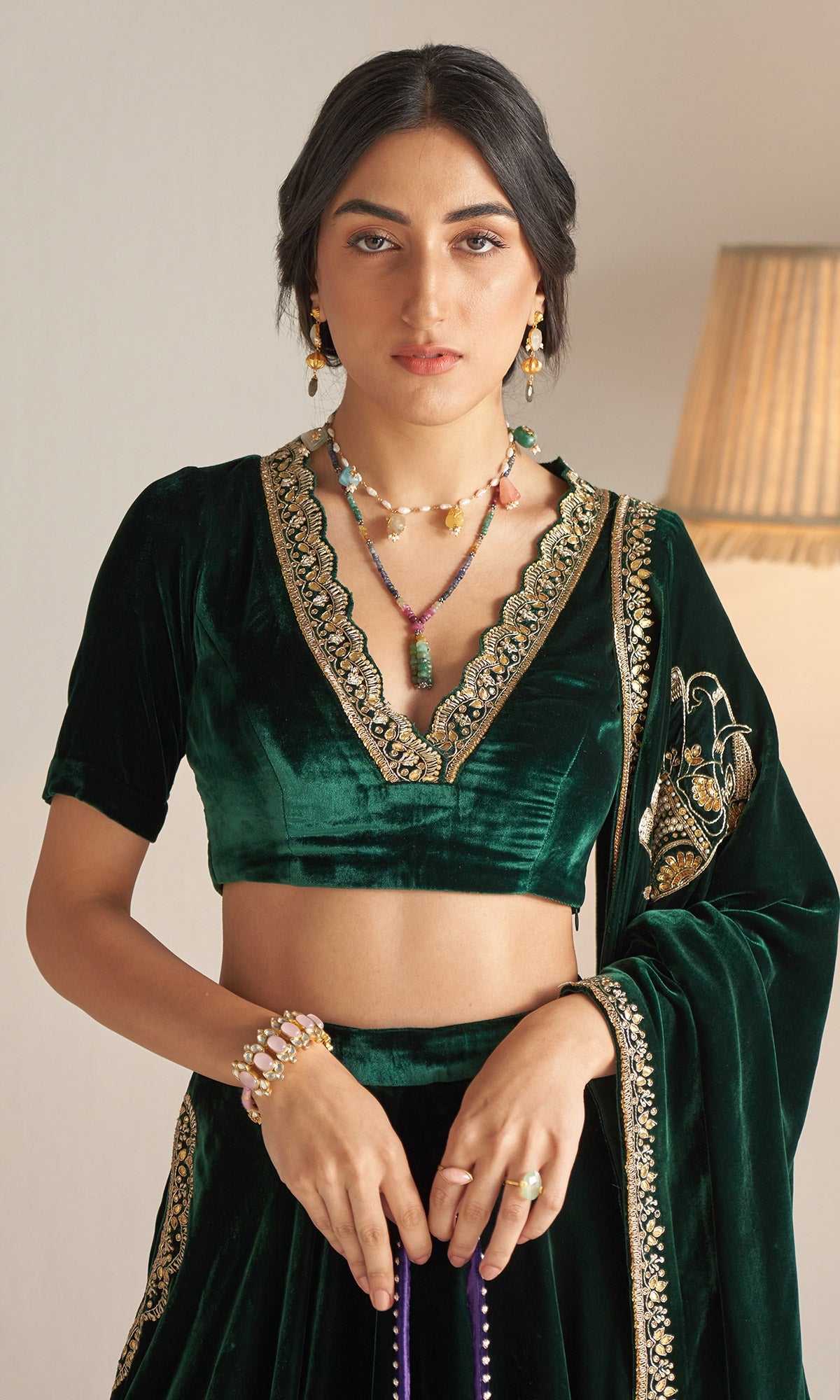 Khizaan Embroidered Emerald Green velvet Lehenga with blouse and shawl