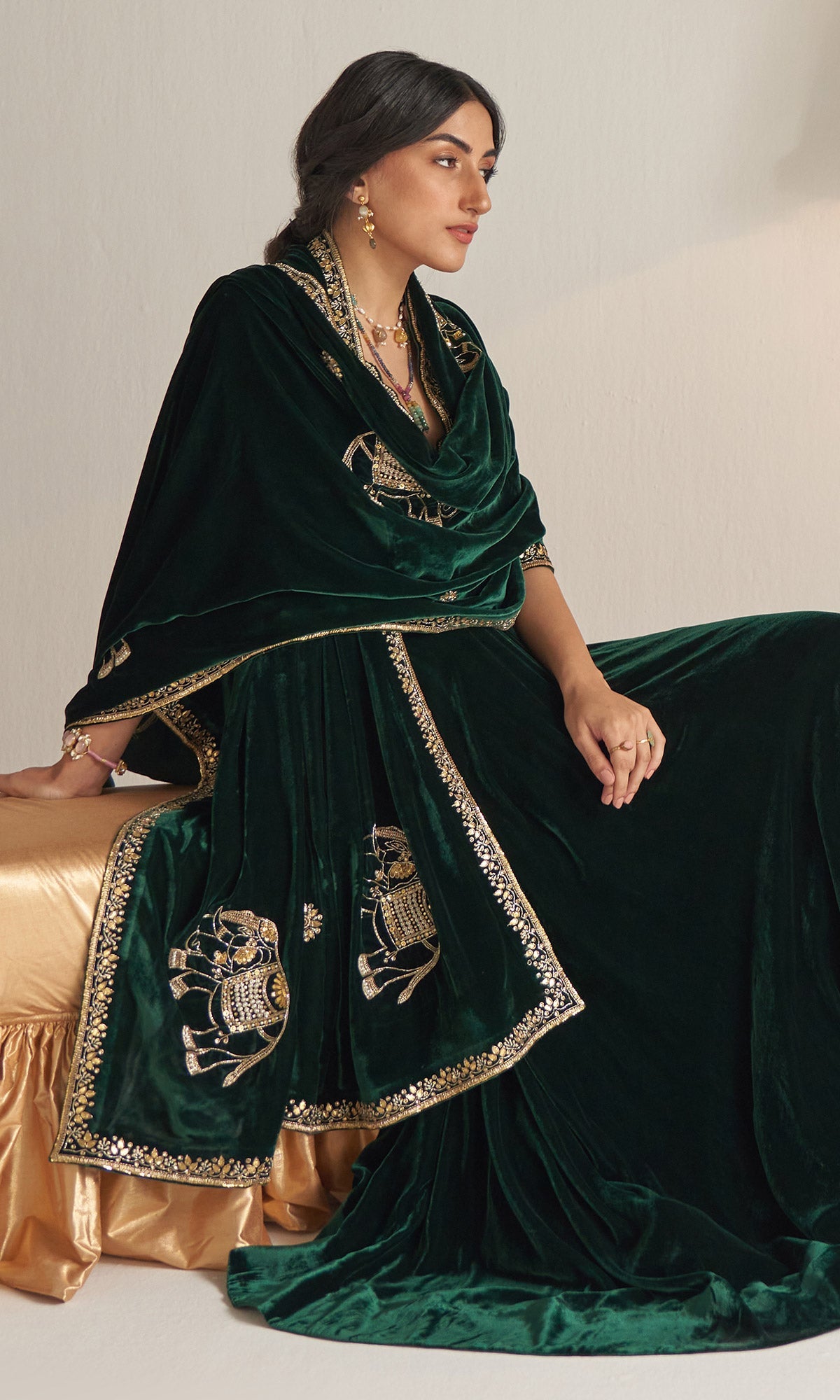 Khizaan Embroidered Emerald Green velvet Lehenga with blouse and shawl