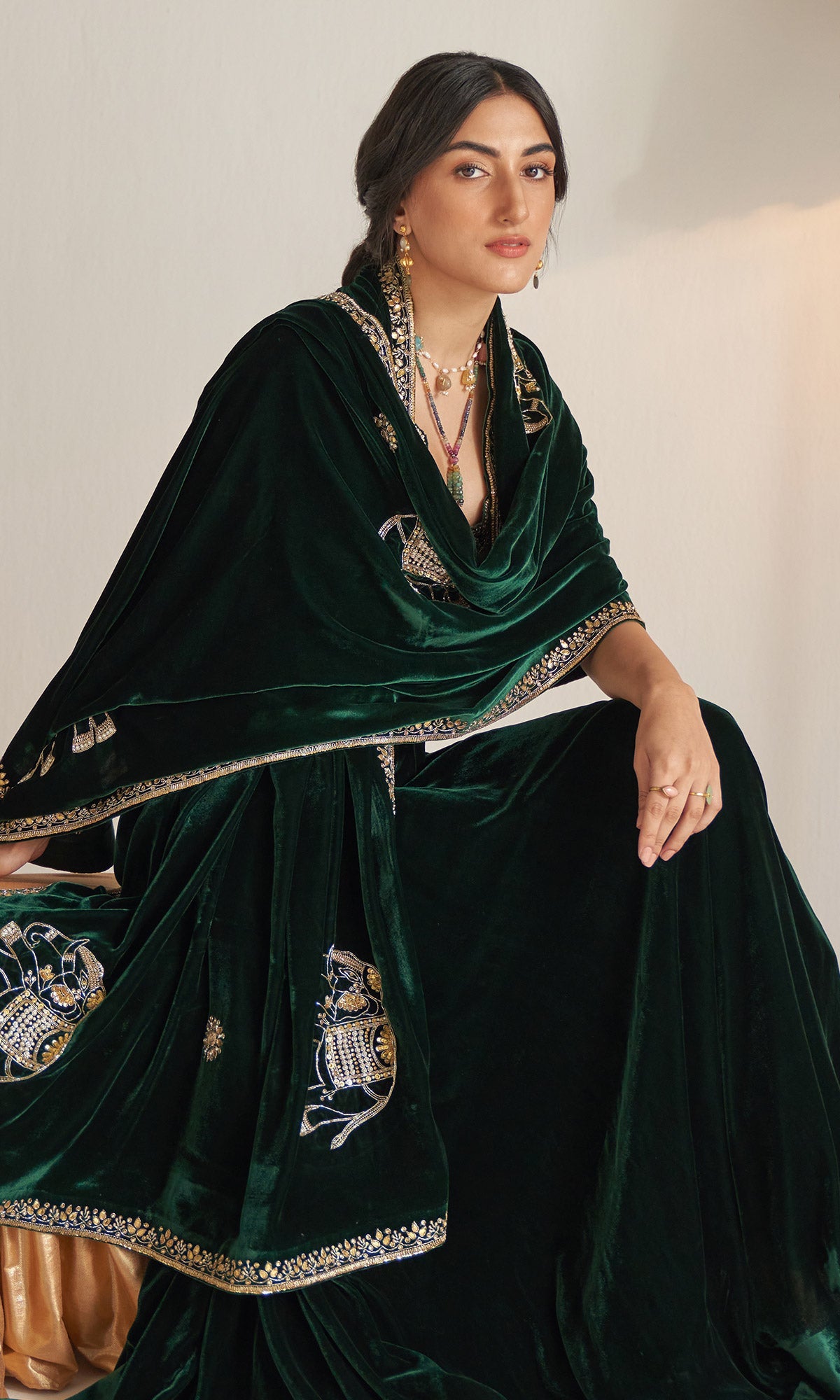 Khizaan Embroidered Emerald Green velvet Lehenga with blouse and shawl