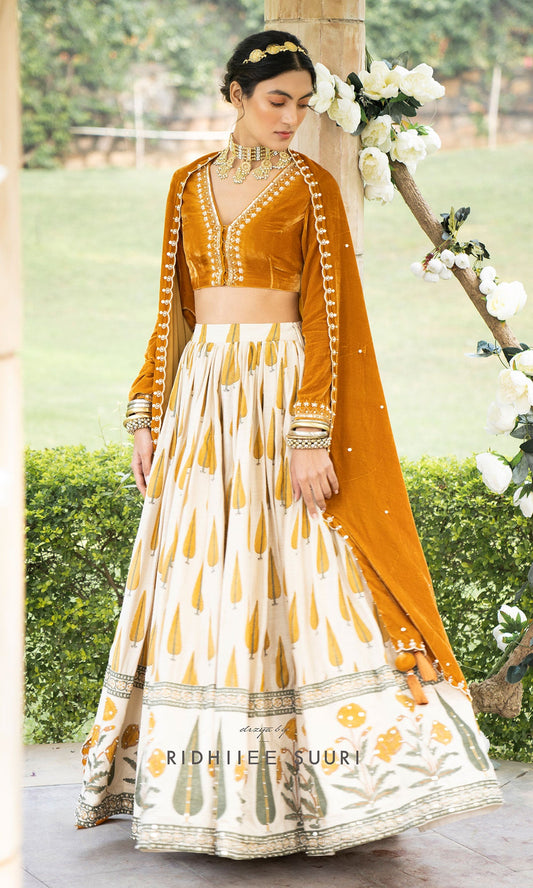 Bareen Mughals Mustard yellow block printed lehenga with velvet embroidered blouse & shawl- SET OF 3